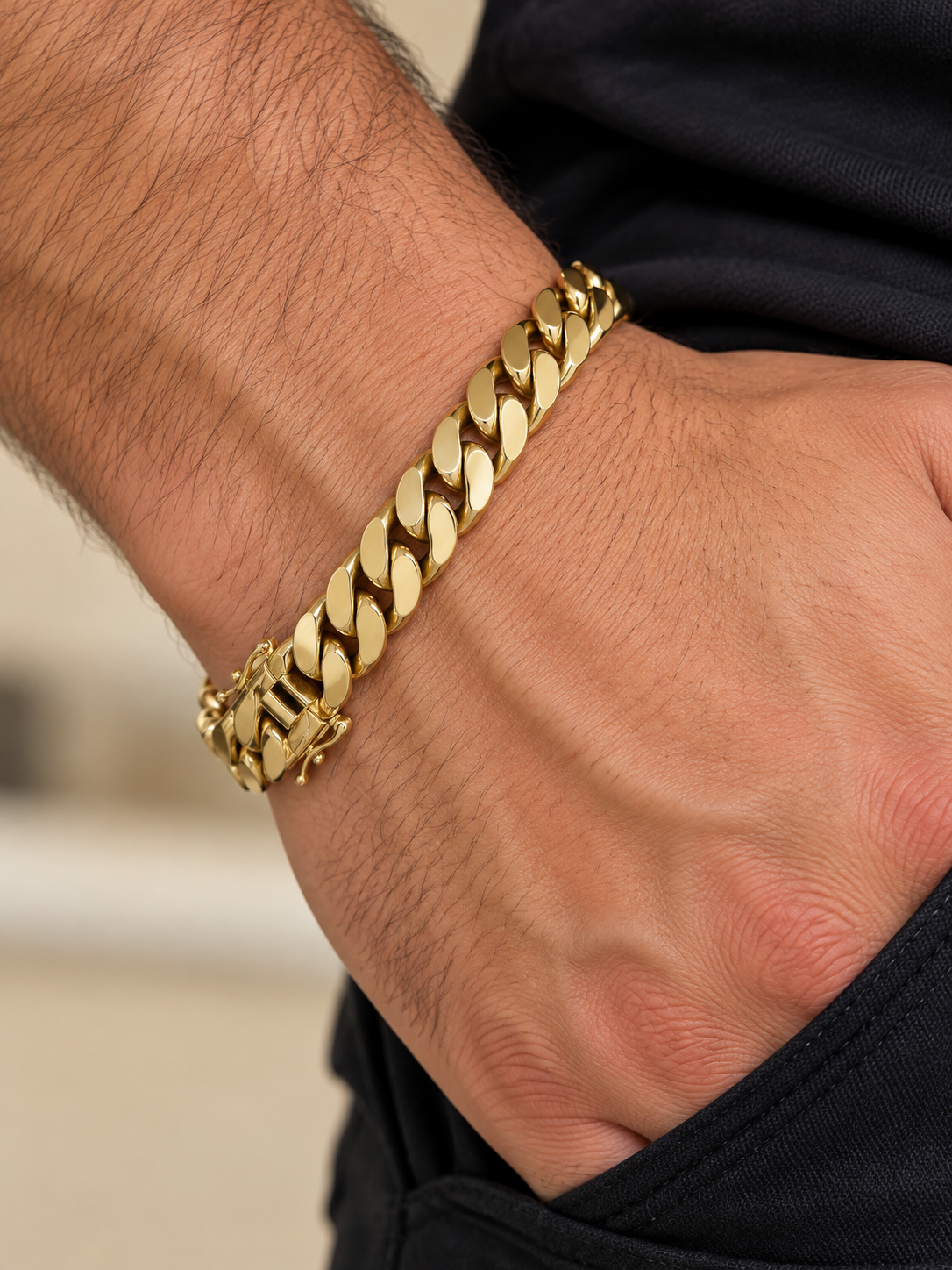 Men's 10K yellow gold semi-solid Cuban link bracelet, 8.2mm, worn on the wrist
