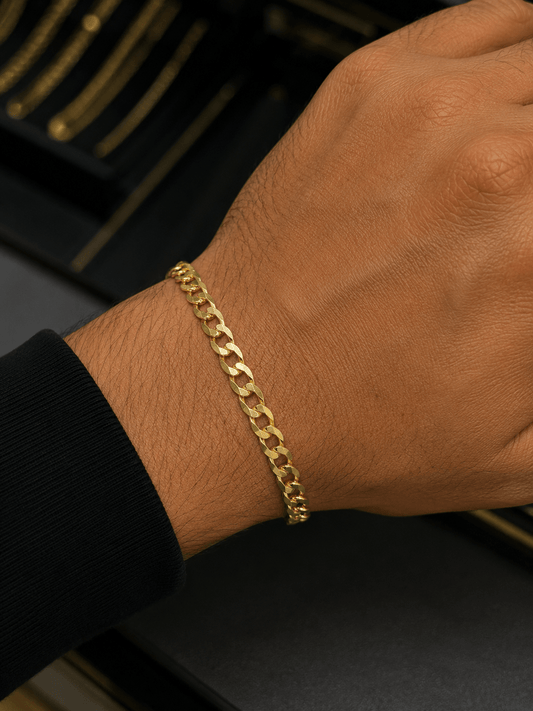 Beautiful Men’s Cuban Link Bracelet crafted in real solid 10K gold. This elegant 5.8 mm bracelet features a classic polished design with a strong secure clasp, perfect for everyday wear or special occasions. - Alejandro Jewelry LLC